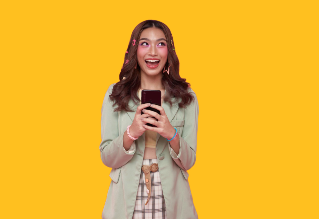 Person with phone on yellow background